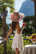 portrait of beautiful woman on the terrace of prestigious hotel
