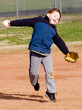 Boy throwing at t-ball practice