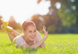 Photo: Happy girl laying on meadow and saluting Happy girl laying on meadow and saluting
