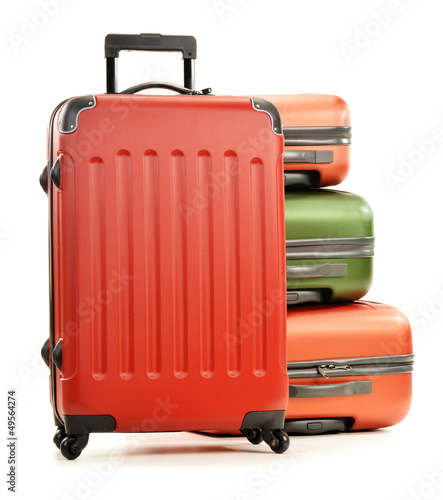 Photo: Luggage consisting of large suitcases isolated on white Luggage consisting of large suitcases isolated on white