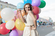 woman with colorful balloons