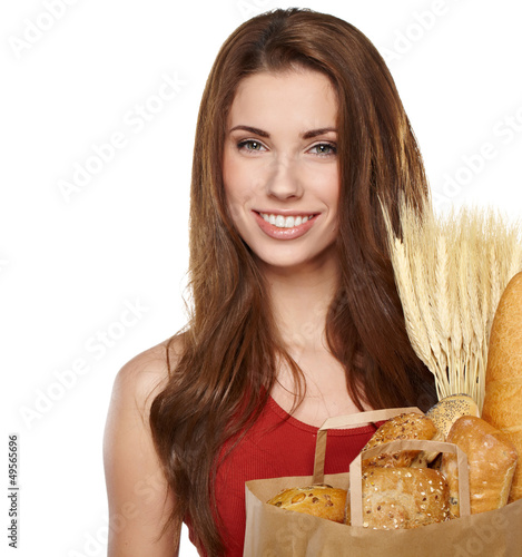 Photo: Smiling woman holding a grocery bag Smiling woman holding a grocery bag