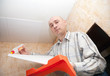 guy glues ceiling tile