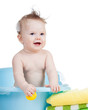 adorable baby taking bath in blue tub