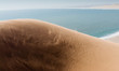 Dune in the Namib desert on a windy day in Namibia