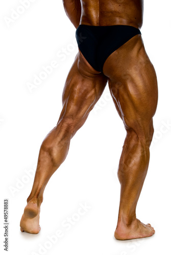 Photo: Legs muscular man back view Legs muscular man back view