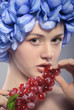 beautiful young girl with red grapes