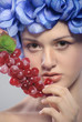 beautiful young girl with red grapes