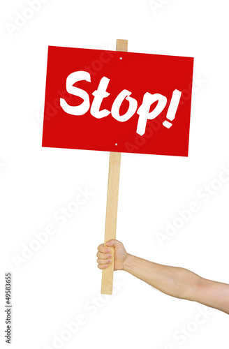 Photo: Person hält Schild mit der Aufschrift Stop Person hält Schild mit der Aufschrift Stop