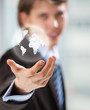 Businessman holding business world