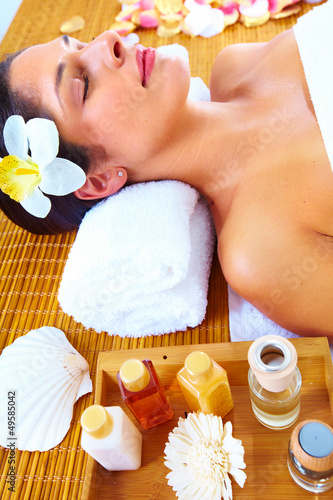Photo: Young woman getting massage in spa salon. Young woman getting massage in spa salon.
