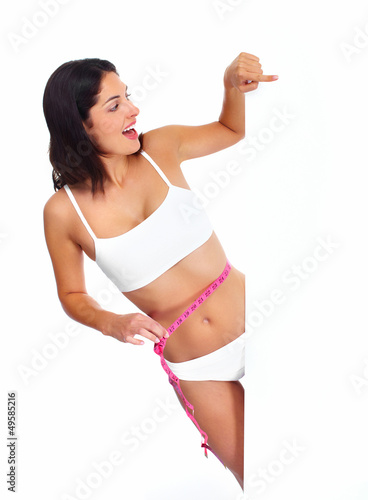 Photo: Beautiful healthy woman with a measuring tape. Beautiful healthy woman with a measuring tape.