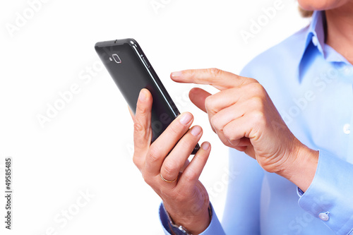 Photo: Hands of woman with a smartphone. Hands of woman with a smartphone.