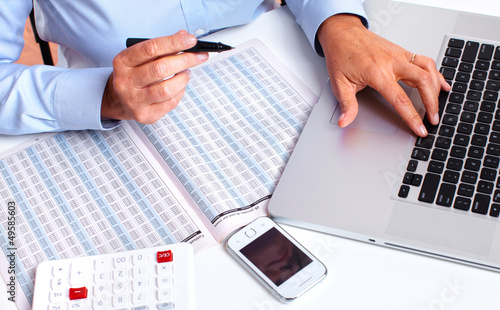 Photo: Hands of accountant business woman. Hands of accountant business woman.