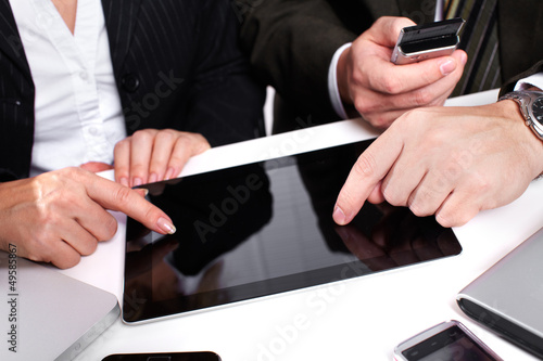Photo: Business people group working with laptop. Business people group working with laptop.