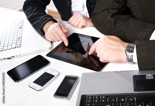 Photo: Business people group working with laptop. Business people group working with laptop.