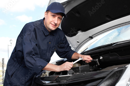 Photo: Professional auto mechanic. Professional auto mechanic.