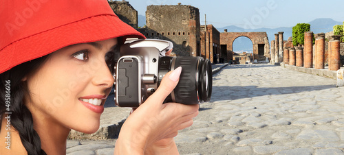 Photo: Tourist woman with a camera. Tourist woman with a camera.