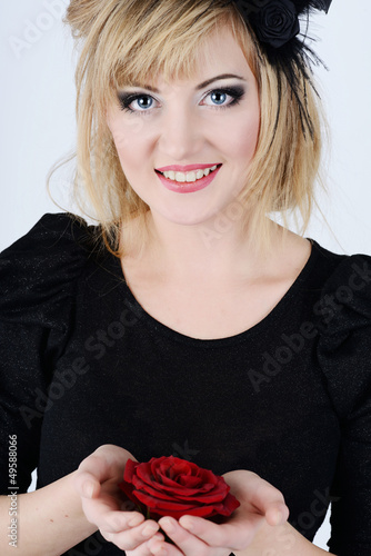 Photo: blue eyed woman with rose blue eyed woman with rose