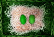 Photo: Pair easter green ecology eggs in natural wicker basket Pair easter green ecology eggs in natural wicker basket
