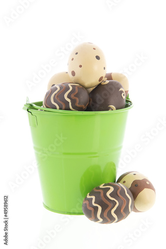 Photo: Chocolate eggs in green bucket Chocolate eggs in green bucket