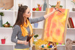 beautiful young woman painter at work,