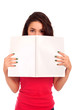 Young woman looking over magazine