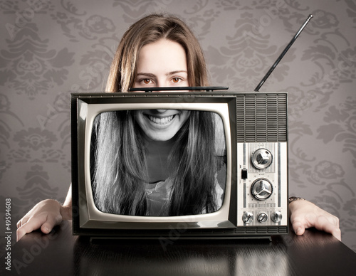Photo: woman with old retro tv woman with old retro tv