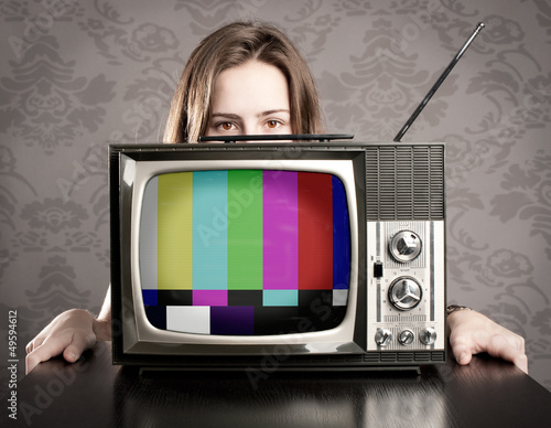 Photo: woman with old retro tv woman with old retro tv