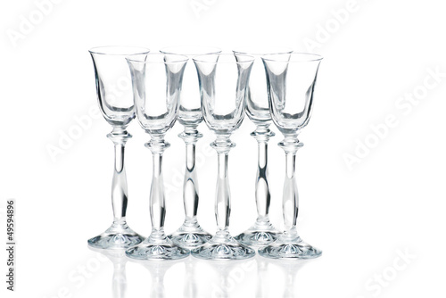 Photo: Empty glasses isolated on white background Empty glasses isolated on white background