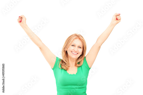 Photo: Beautiful mature woman gesturing happiness Beautiful mature woman gesturing happiness