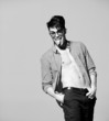 sexy man model doing a fashion shoot in the studio - bw stylized