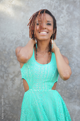 Photo: Beautiful model posing with hands on neck Beautiful model posing with hands on neck
