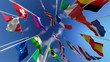 Flags waving in the wind against blue sky