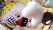 The baby lies in the crib under cot mobile