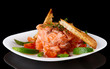 Salmon carpaccio in plate isolated on black