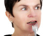 Photo: Woman with fork to your mouth Woman with fork to your mouth