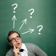 Man at the Blackboard with Questions