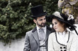 Old Fashioned dressed couple in love in the park