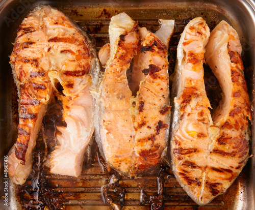Photo: Three salmon steaks fried on grill pan Three salmon steaks fried on grill pan