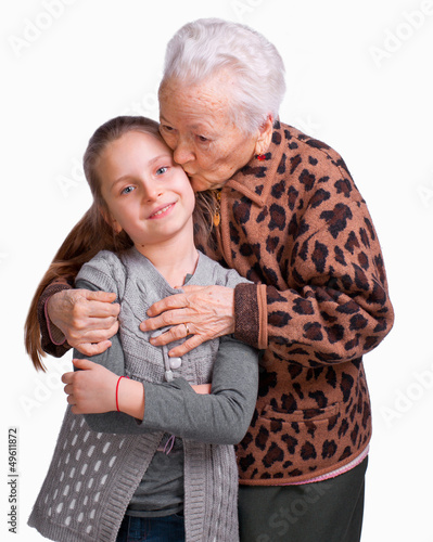 Photo: Grandmother kissing her granddaughter Grandmother kissing her granddaughter