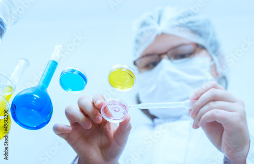 Photo: laboratory assistant analyzing a liquid laboratory assistant analyzing a liquid