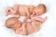 Twins holding hands