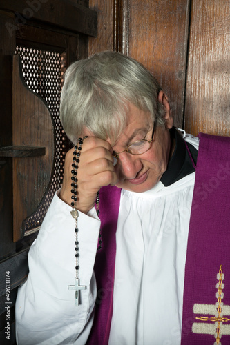 Photo: Confession box and priest Confession box and priest