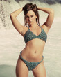 Photo: woman in bikini standing in front of a waterfall woman in bikini standing in front of a waterfall