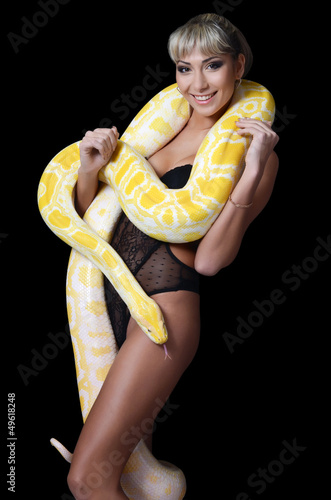 Photo: The beautiful woman with the big yellow snake The beautiful woman with the big yellow snake