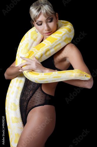 Photo: The beautiful woman with the big yellow snake The beautiful woman with the big yellow snake