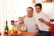 Foto: Family in home kitchen drinking wine Family in home kitchen drinking wine