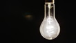 Real light bulb turning on, flickering and turning off
