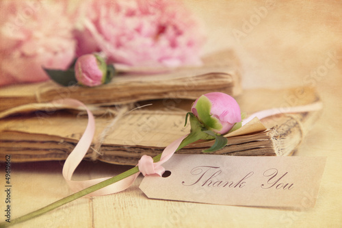 Photo: Peony flowers with vintage papers and gift card Peony flowers with vintage papers and gift card